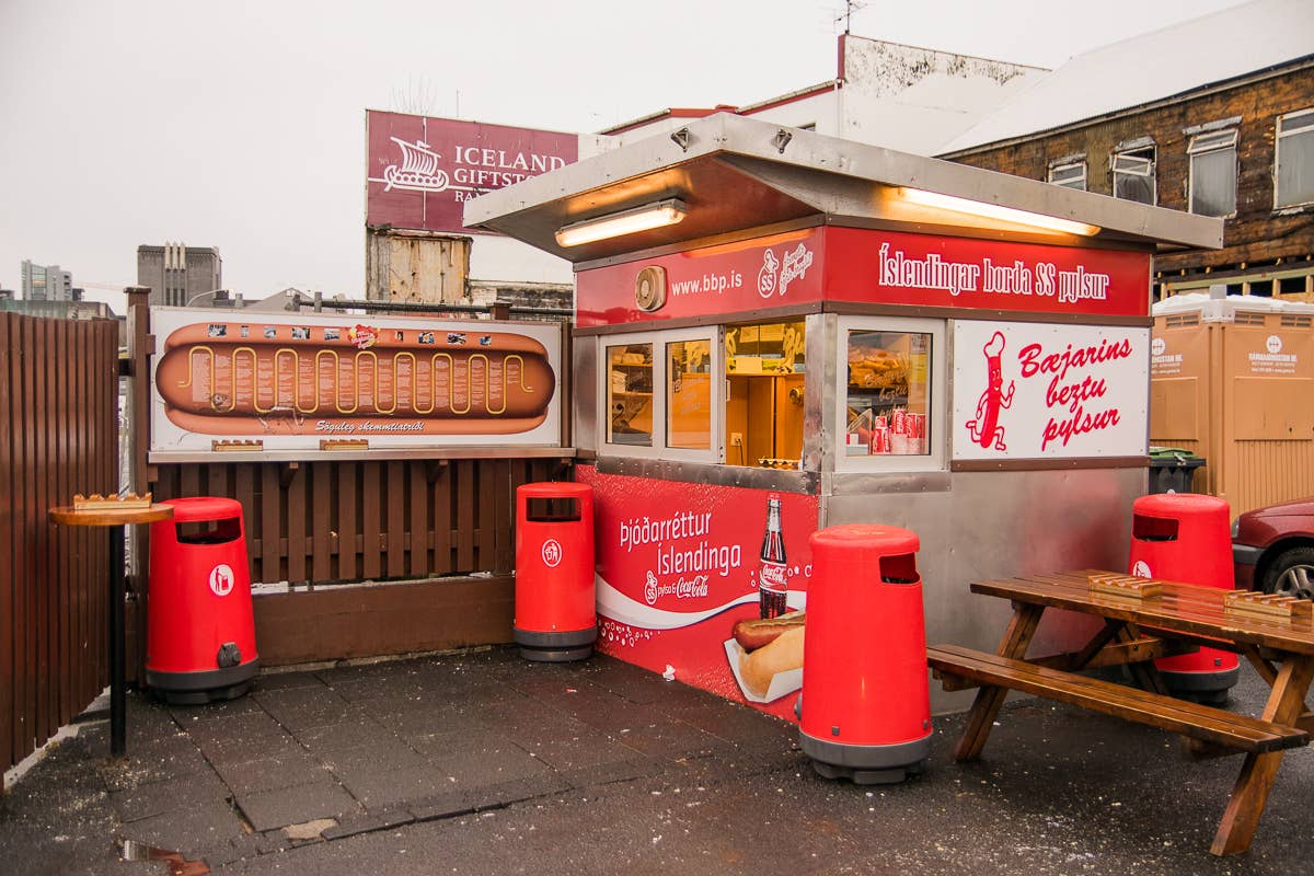 Bæjarins Beztu Pylsur hot dog stand with customers outside on a Reykjavik street corner
