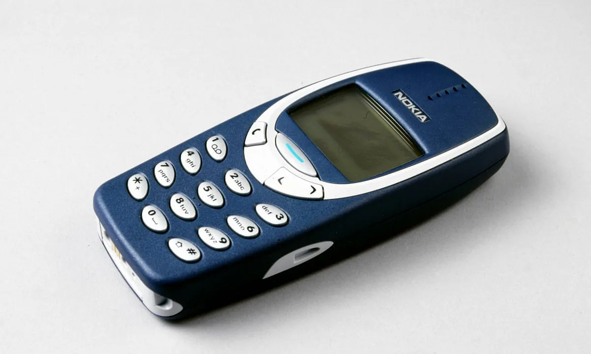Classic Nokia 3310 brick phone representing calls-and-texts-only mobile access
