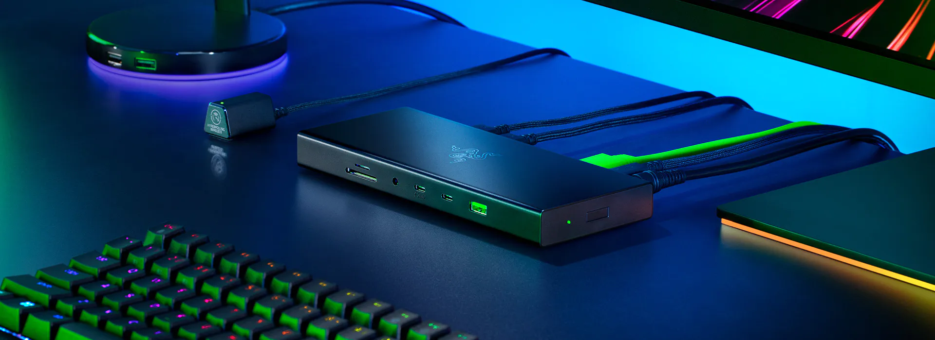 Razer USB4 Dock with black metal casing and front ports on a dark desk