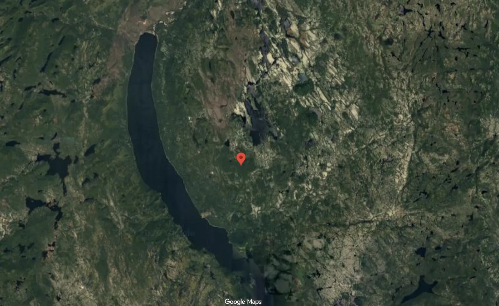 Google Maps satellite view of Quebec's Cote-Nord region showing the circular Uhackatik crater feature